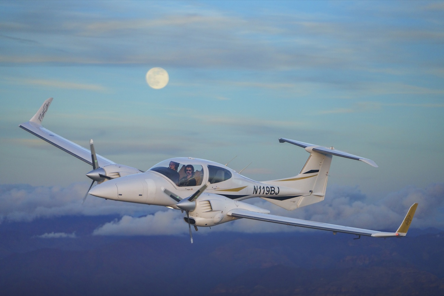 DA42 air to air under the moon